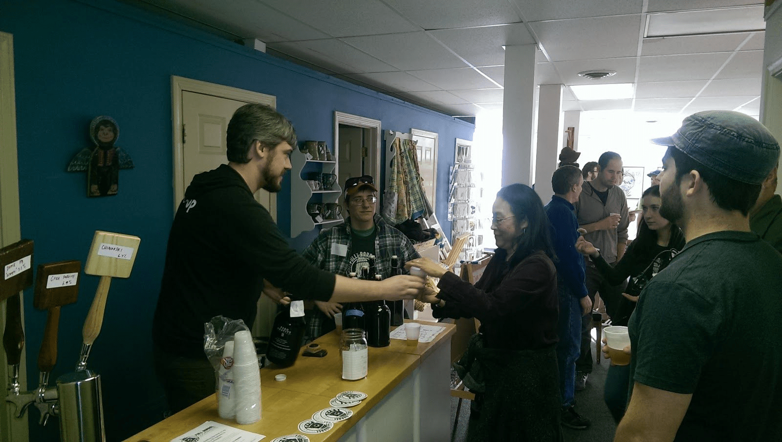 Matt Cropp serving beer at the cooperative pub