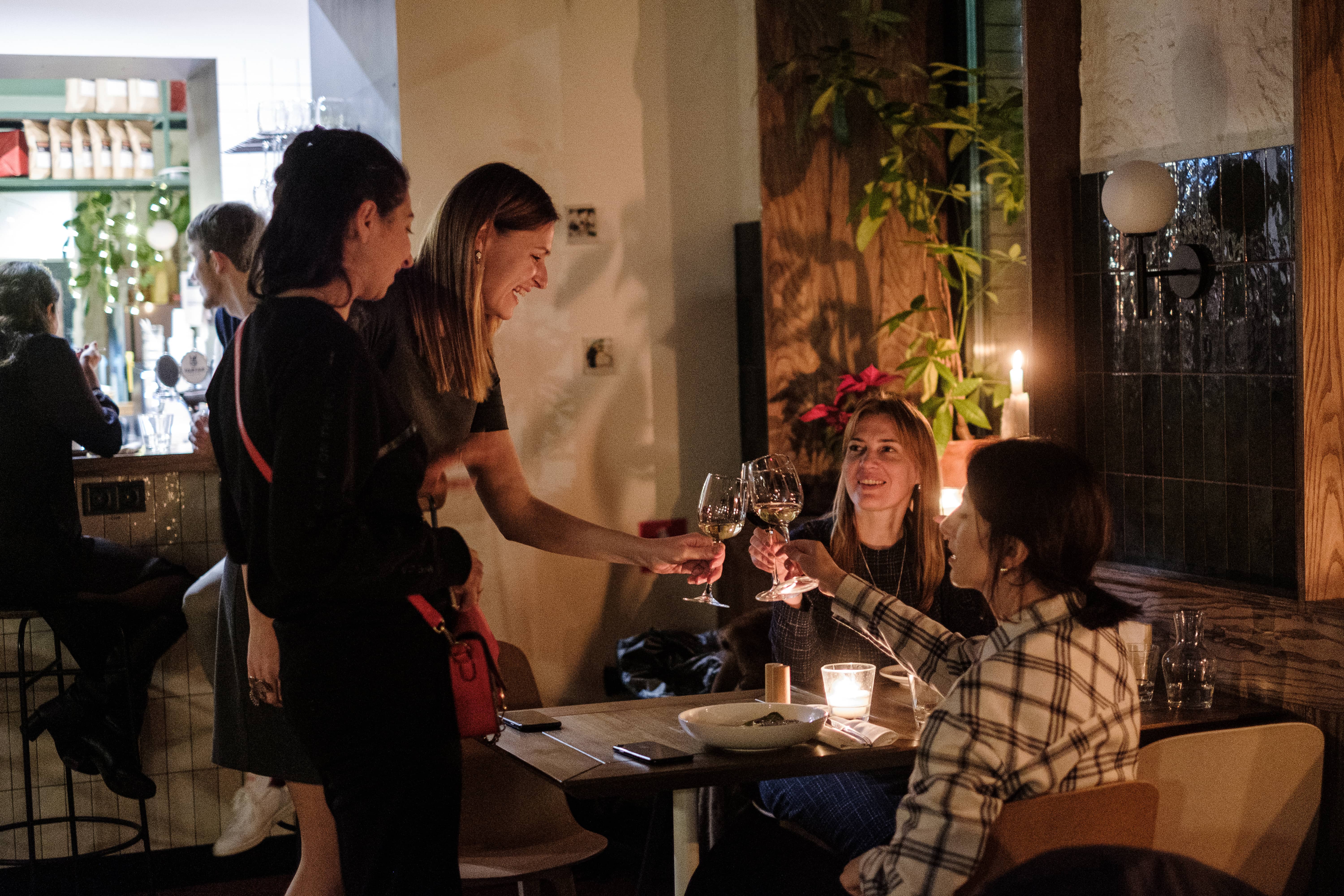 investors and founders cheers at a cozy table